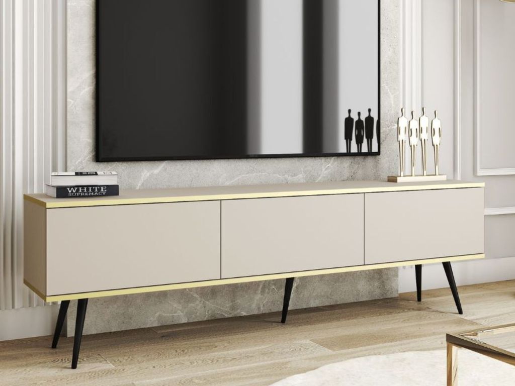 A modern TV stand with a minimalist design, featuring three cabinets and sleek metal legs, placed in a well-lit living room setting.