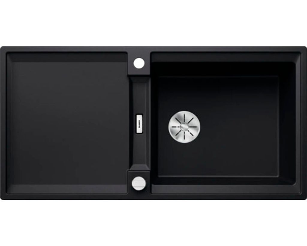 A top-down view of a black kitchen sink with a drainboard and a main basin.