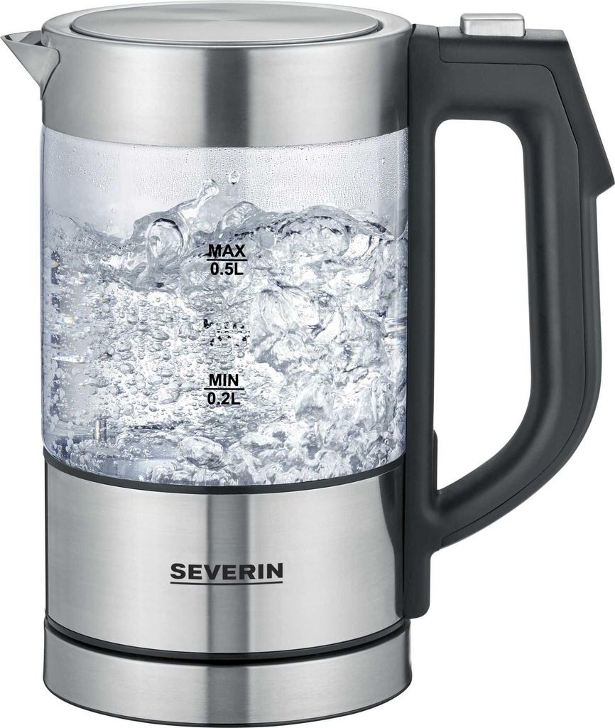 A glass electric kettle filled with boiling water.