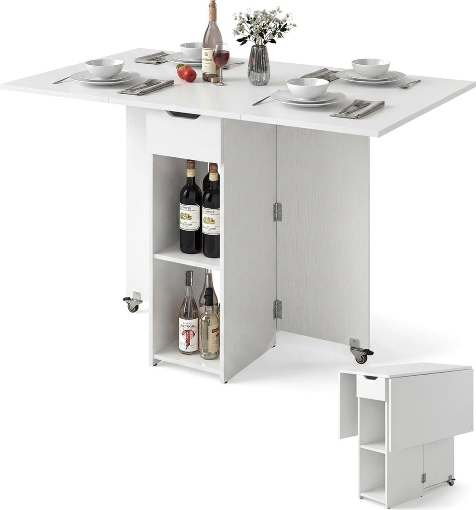 A white folding dining table with storage and wheels, set with plates, glasses, and bottles of wine.