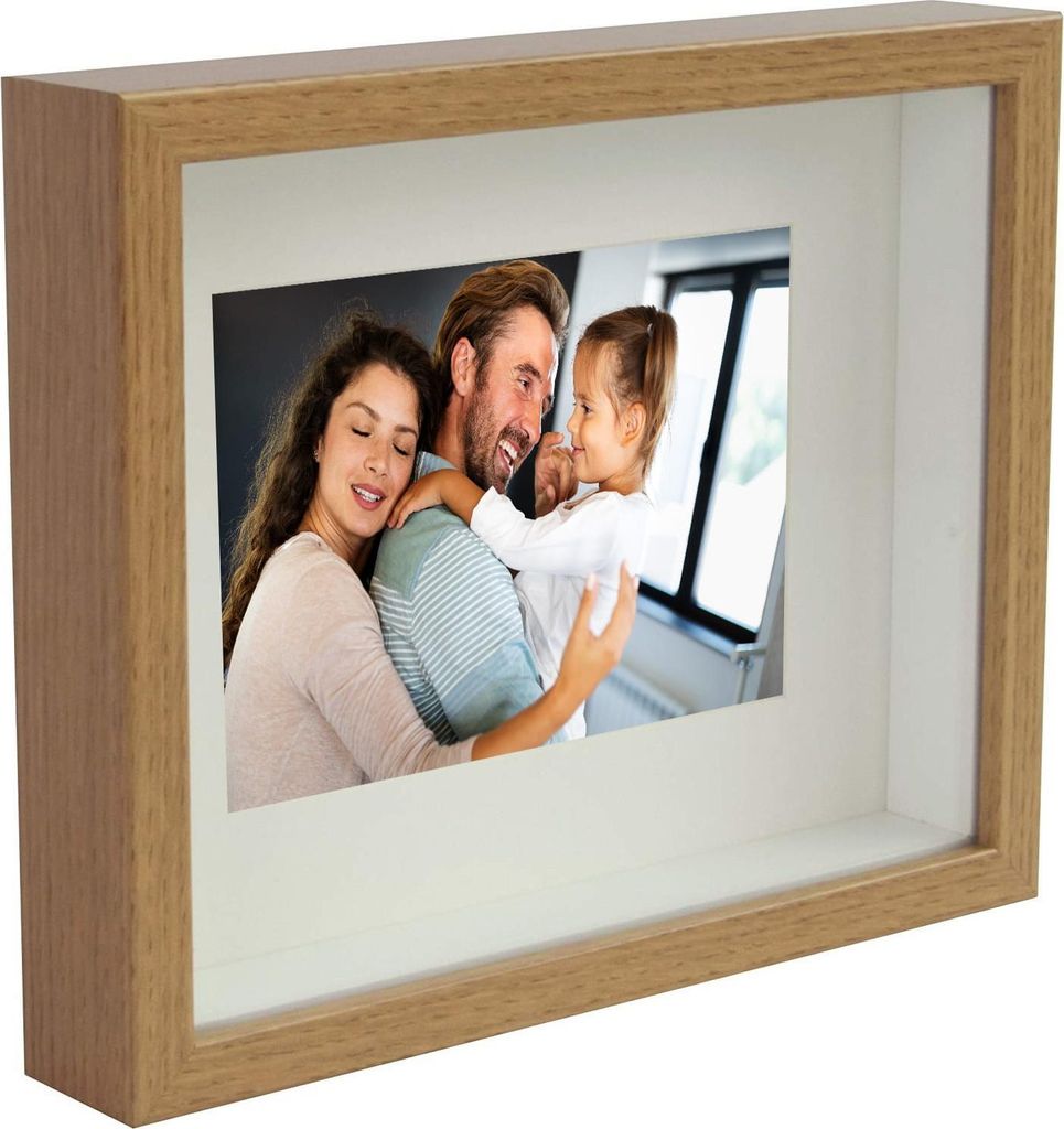 A family photo in a shadow box frame.