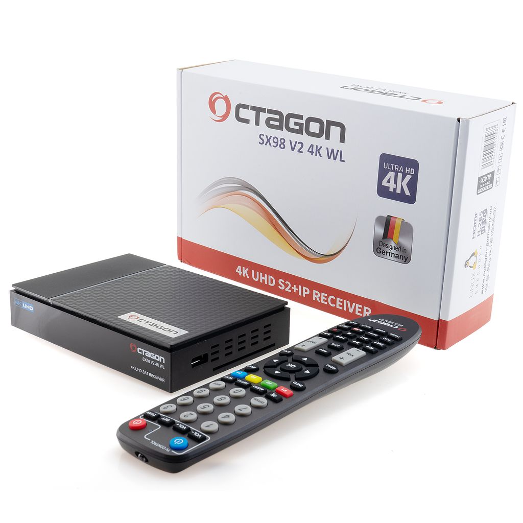 A black satellite receiver, its remote control, and its packaging are arranged on a white background.