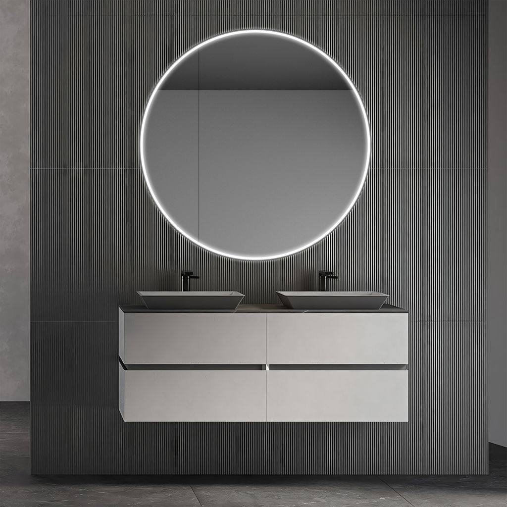 A modern bathroom vanity with two sinks and a round illuminated mirror.