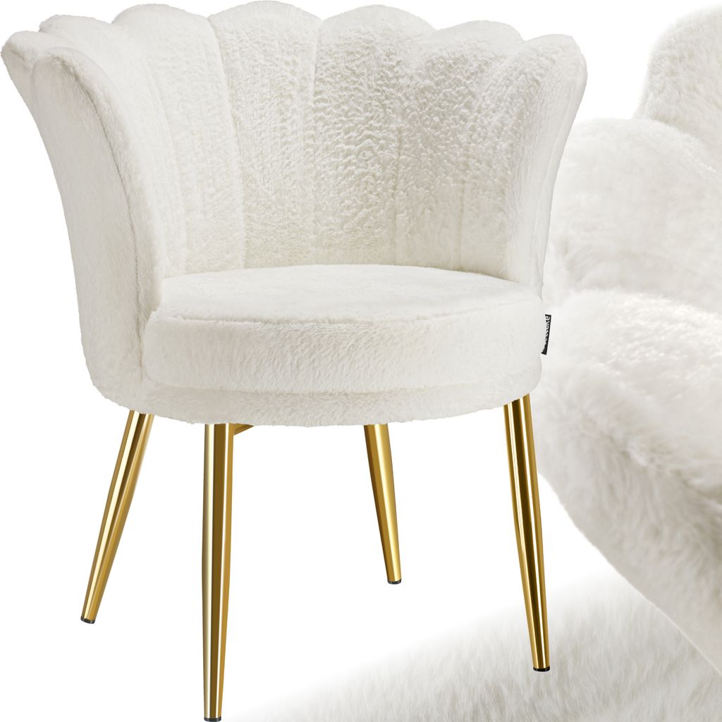 A white fluffy armchair with gold legs.