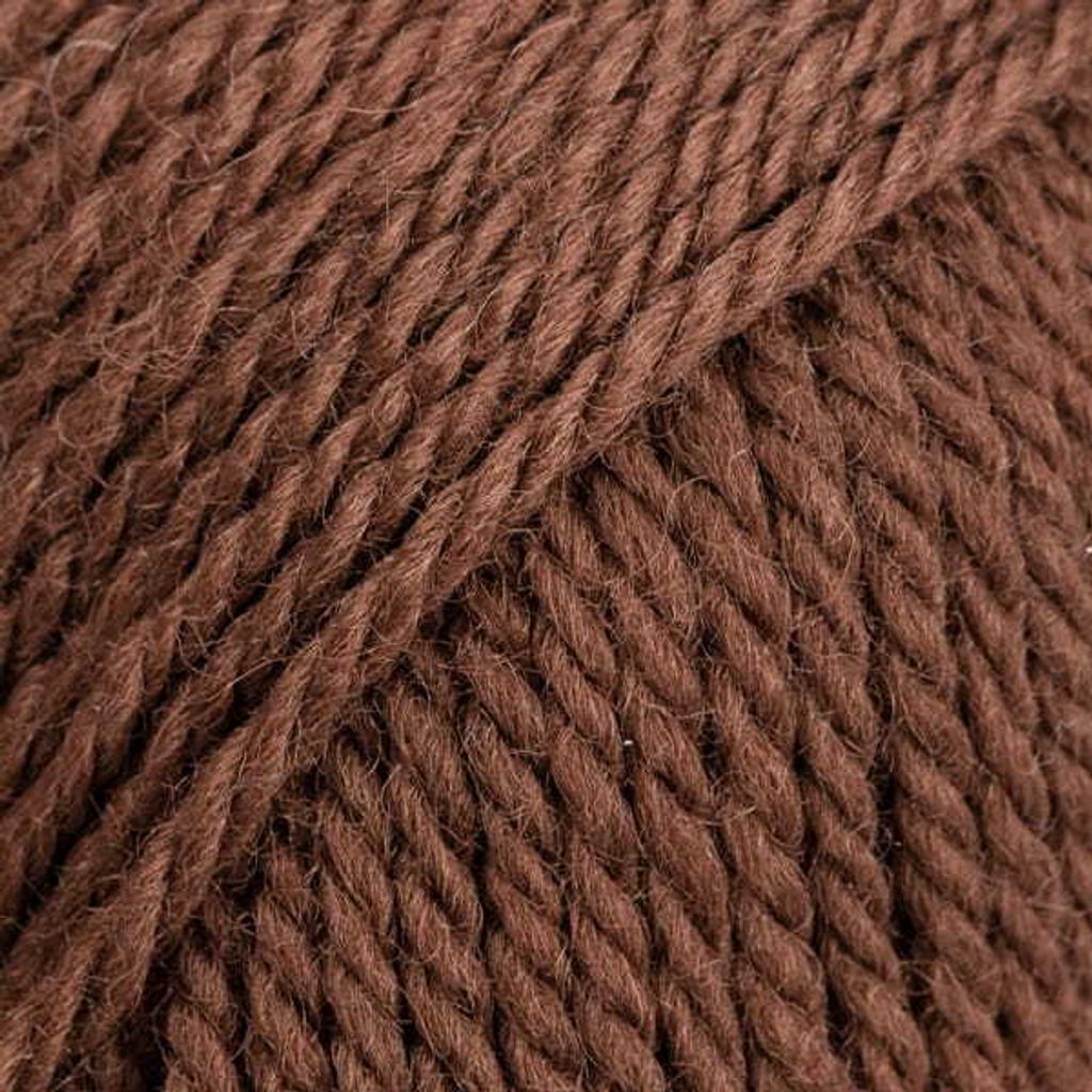 A close-up, detailed view of brown yarn.