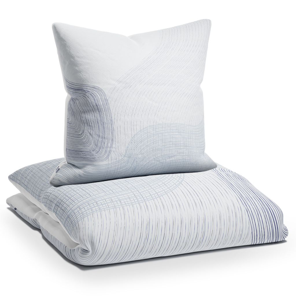 A folded duvet and pillow with a wave-like pattern.