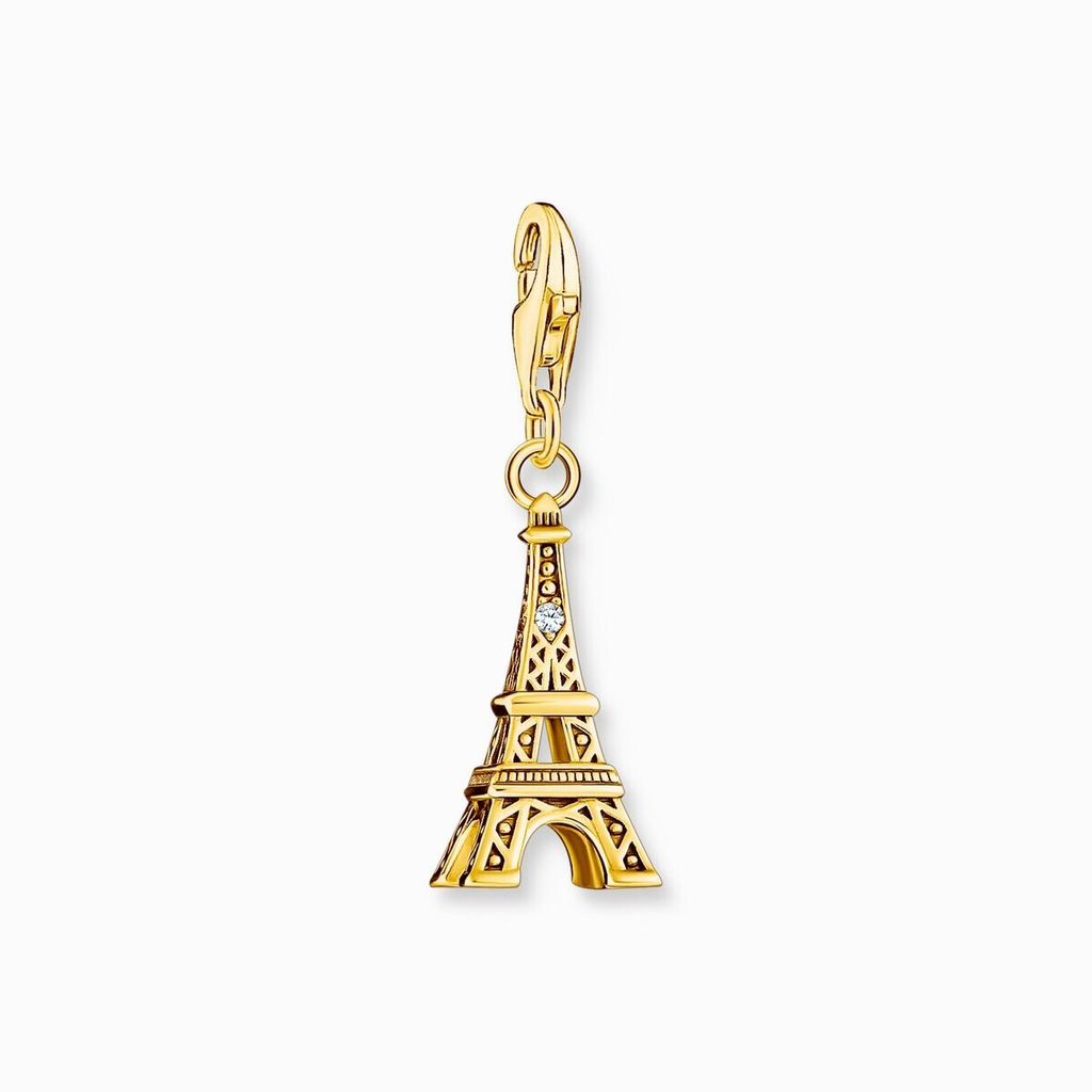 A gold Eiffel Tower charm with a small diamond accent, hanging from a clasp.