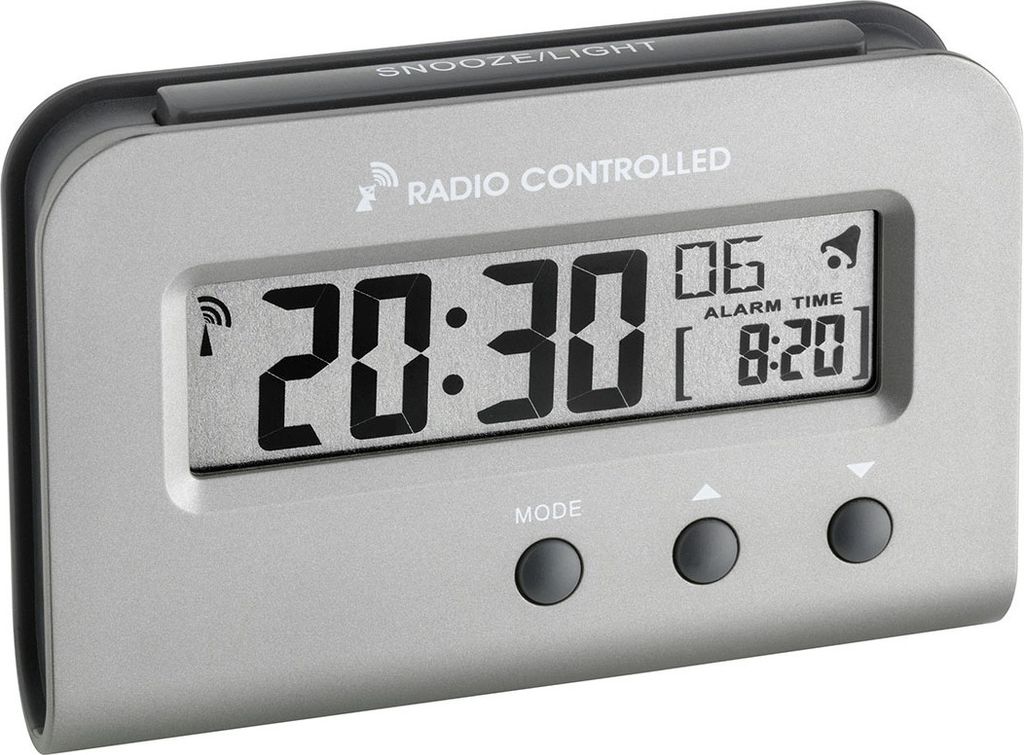 A digital alarm clock is shown against a light gray background.