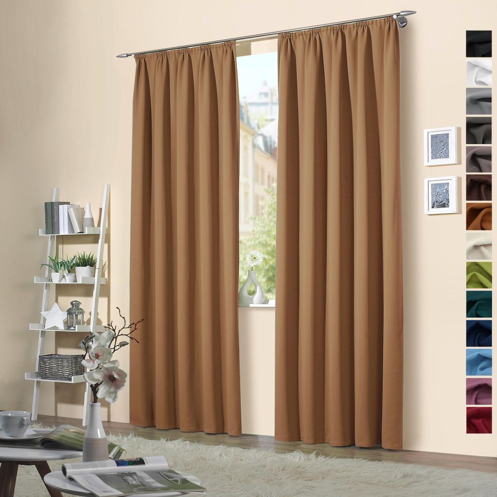 A room interior with curtains hanging in front of a window, and a shelf with decorative items on the left.