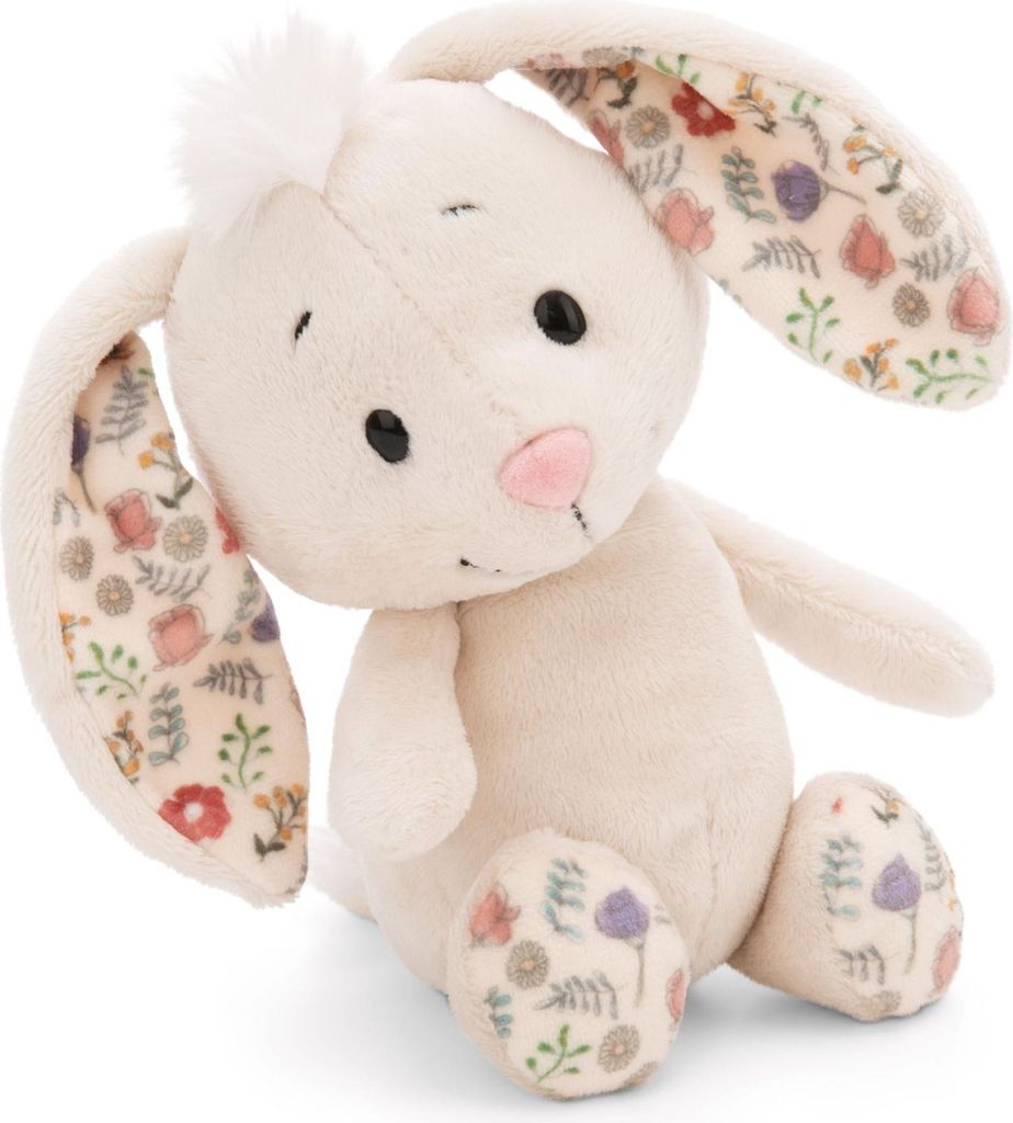 A plush toy bunny sitting on a white background.