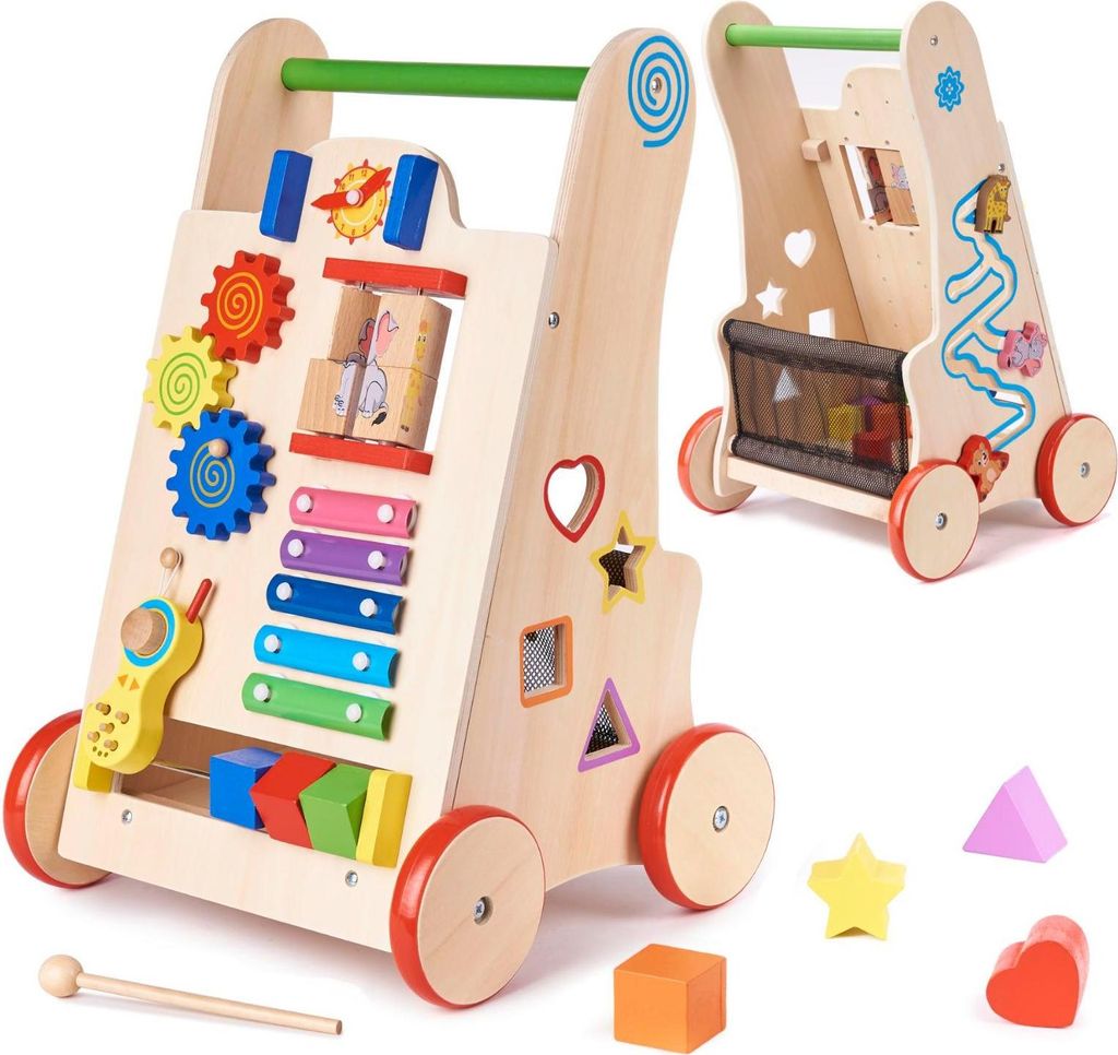 A wooden baby walker with various educational toys attached, shown from a slightly angled front view. A second walker is visible in the background, also angled.