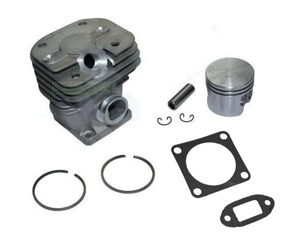 A set of chainsaw engine parts laid out on a white background.