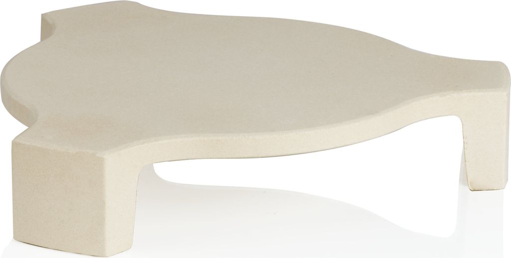 A beige ceramic pizza stone with a curved shape and two legs, shown on a white background.