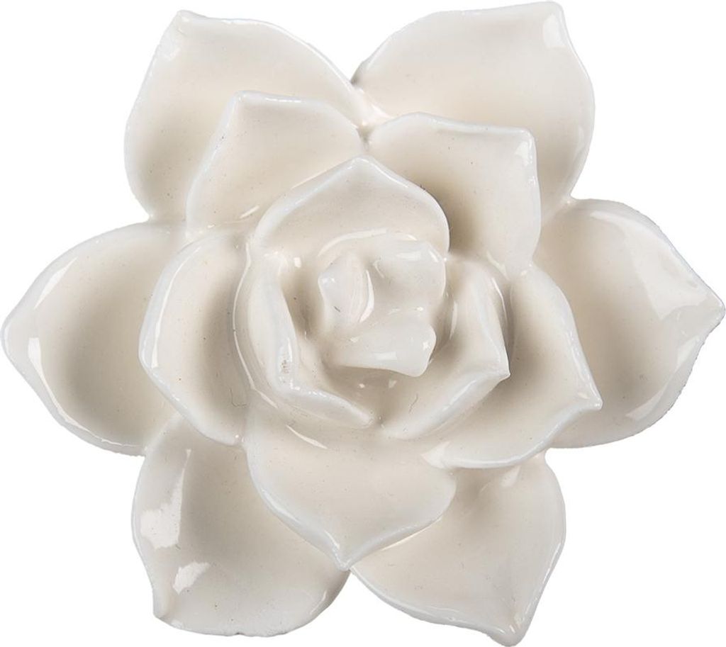 A close-up studio shot of a decorative ceramic flower.