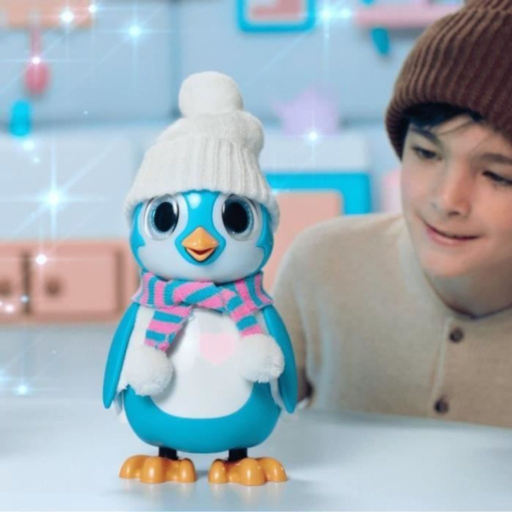 A child is looking at a toy penguin.