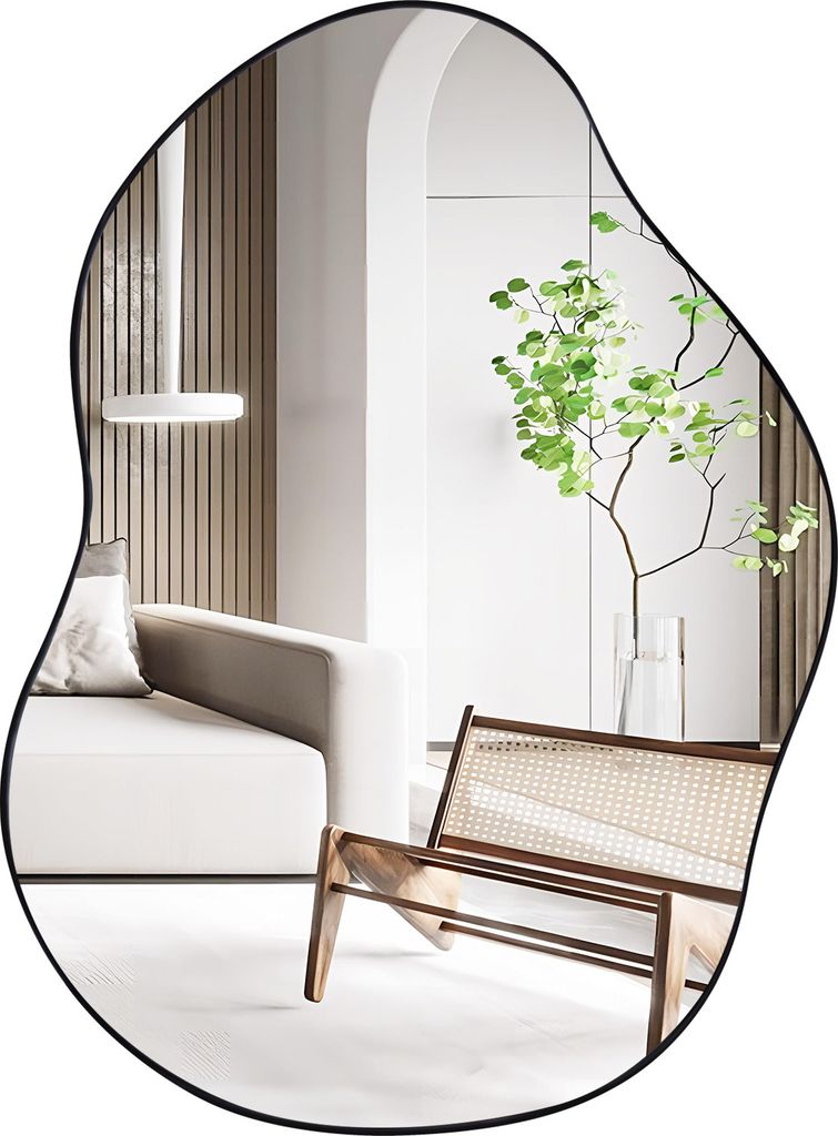 A modern living room with a couch, chair, and a plant reflected in an asymmetrical mirror.