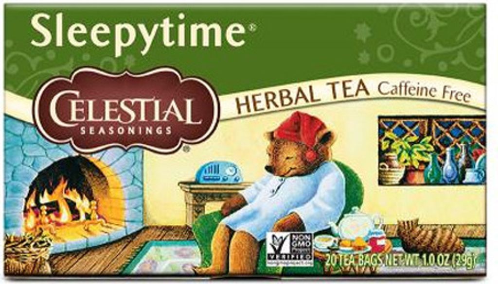 A box of Celestial Seasonings Sleepytime Herbal Tea, featuring an illustration of a bear in pajamas by a fireplace.