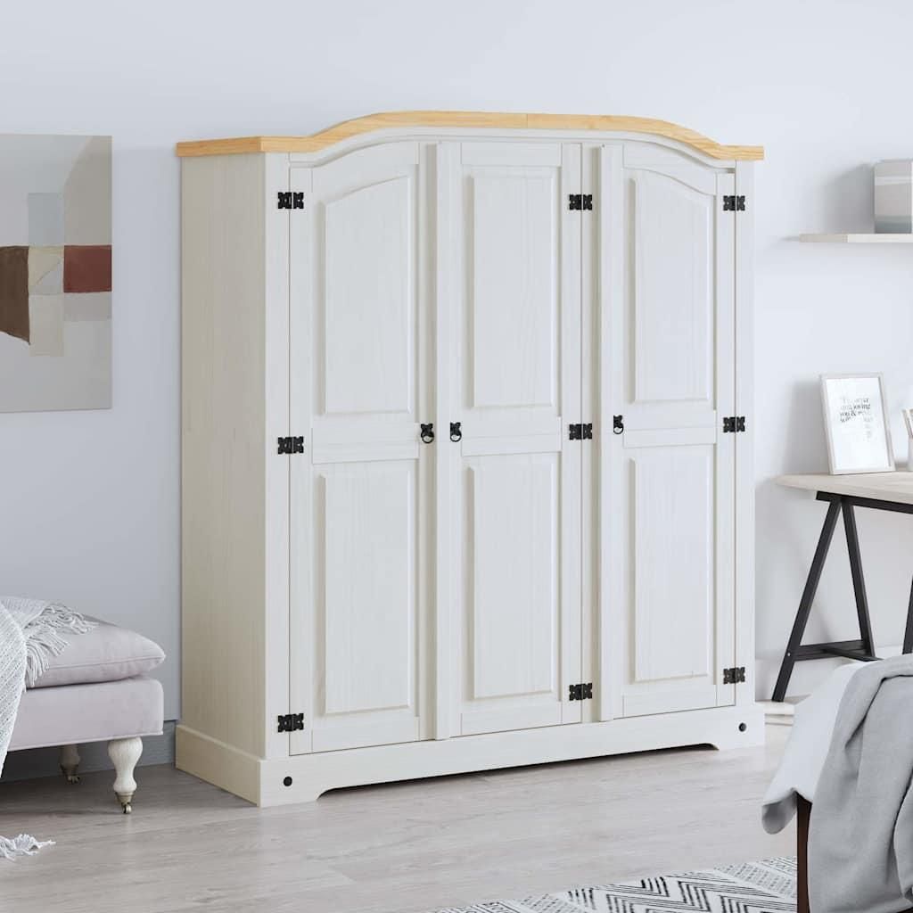 A white wardrobe with a wooden top is shown in a room setting.