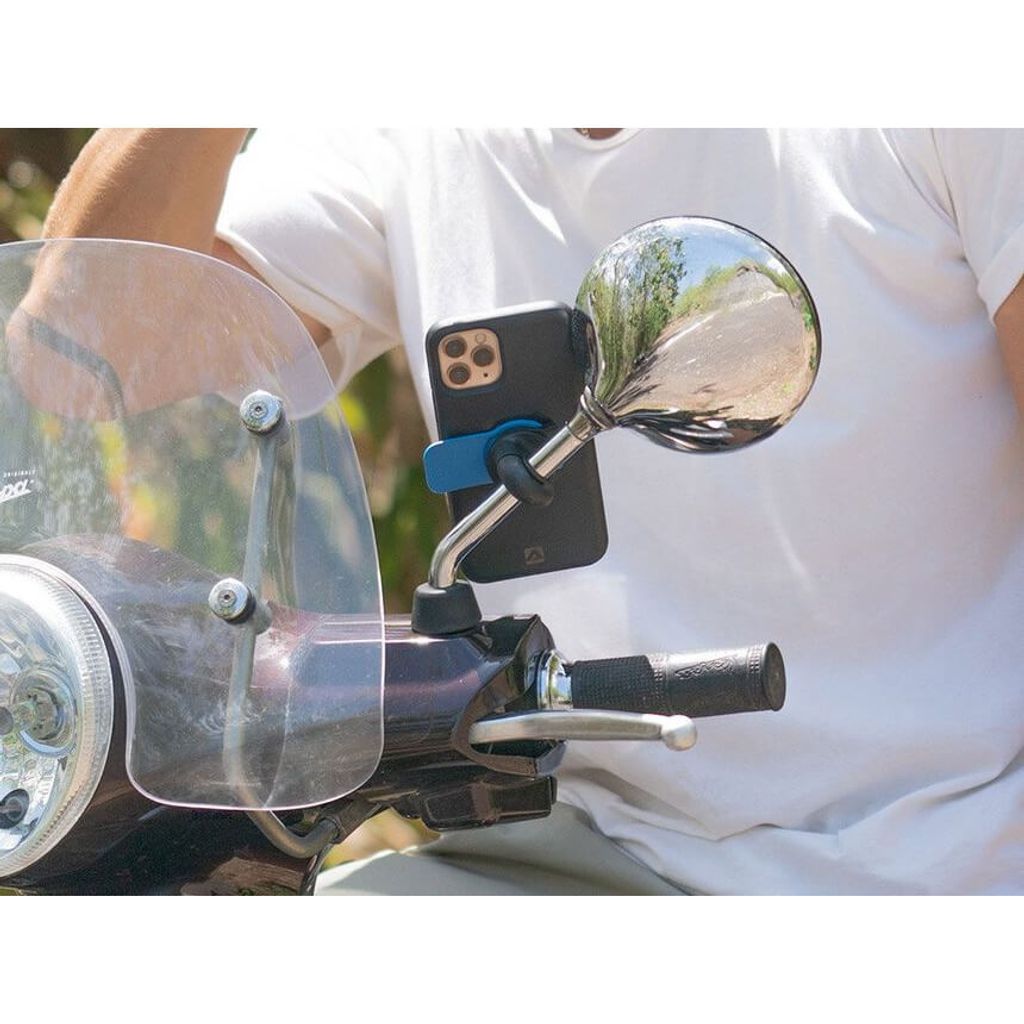 A person is riding a scooter with a phone mounted on the handlebar mirror.