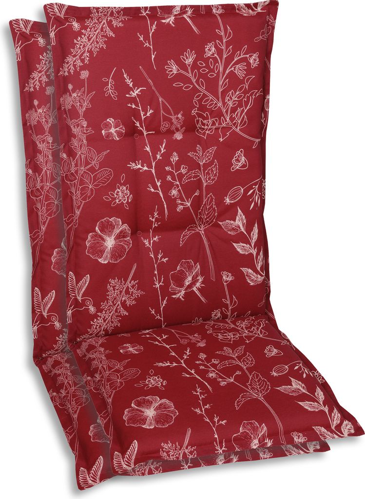 A red chair cushion with a white floral pattern.