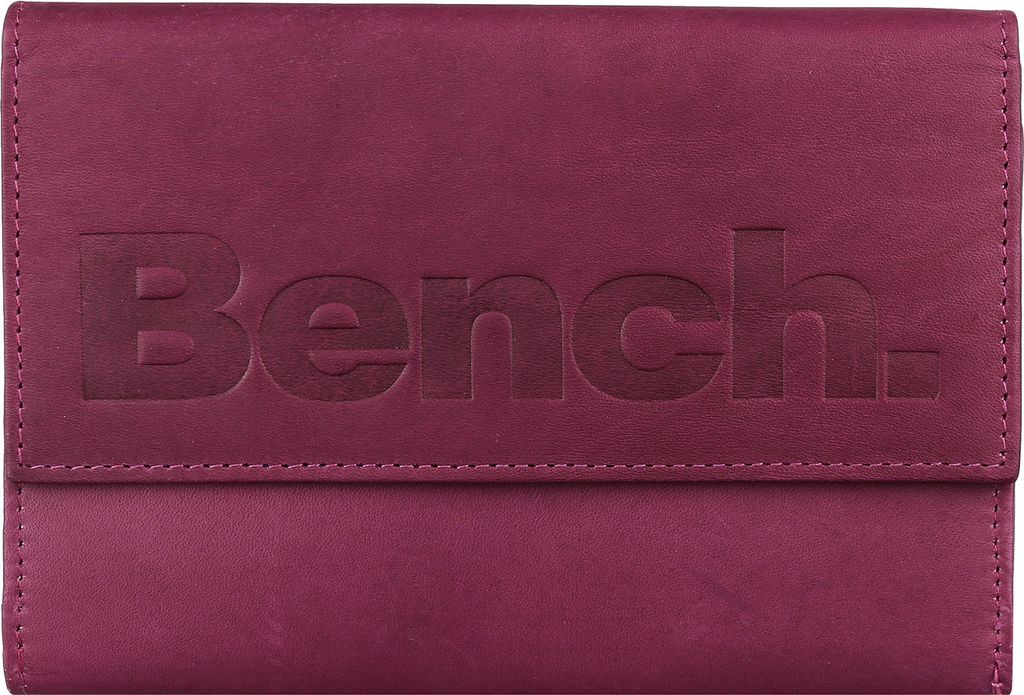 A close-up, front-facing view of a closed berry-colored leather wallet with the embossed 'Bench.' logo.