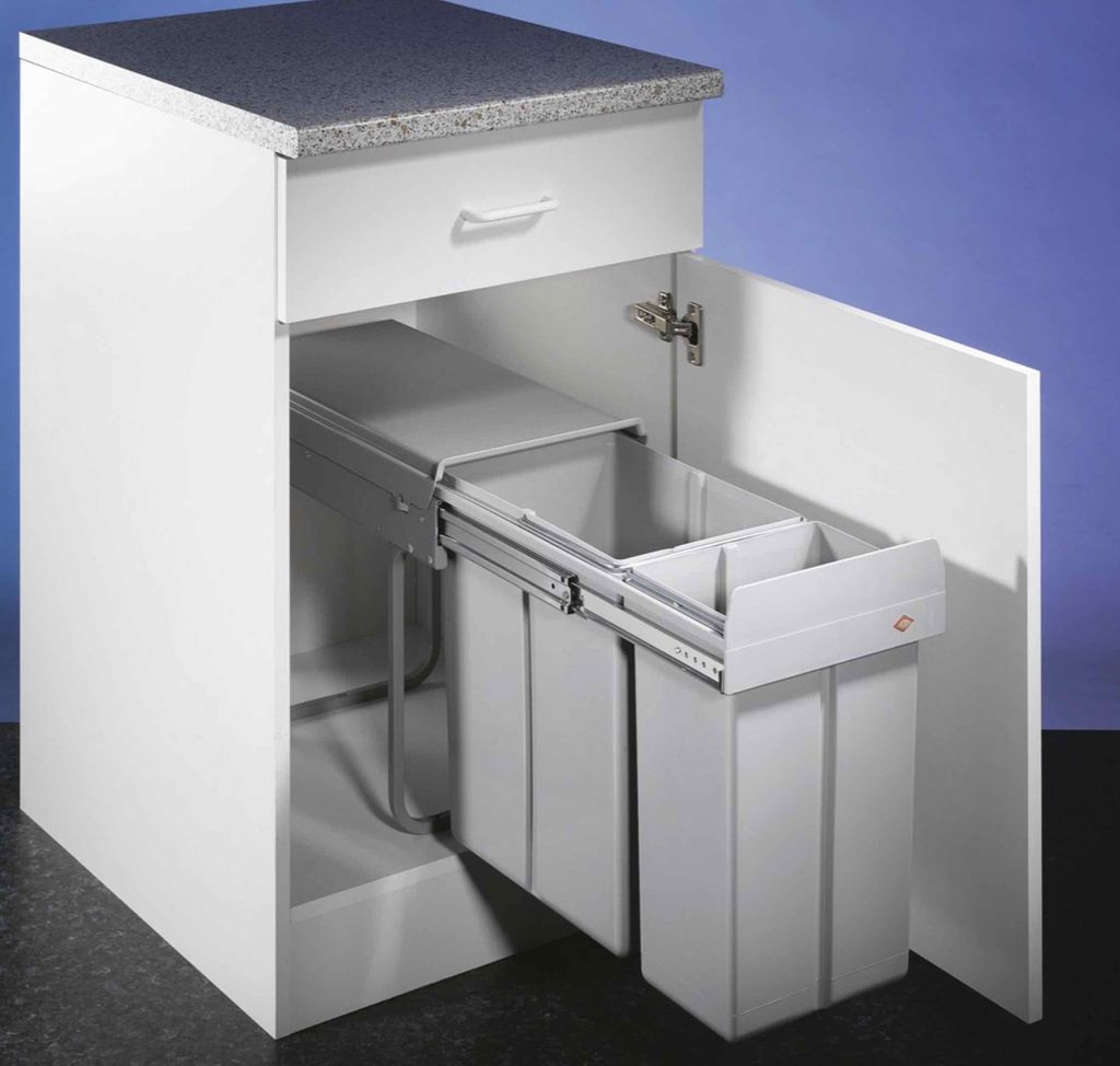 A white kitchen cabinet with a pull-out trash bin system, showing two gray bins.