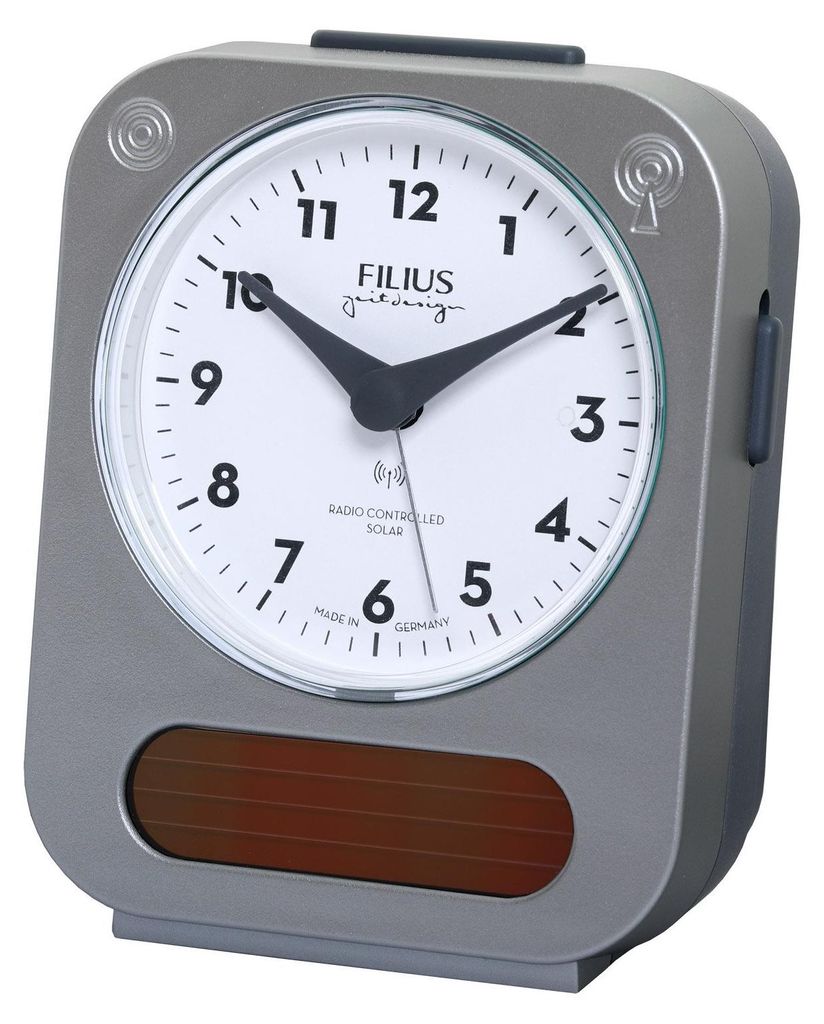 A close-up studio shot of a gray alarm clock with a white face.
