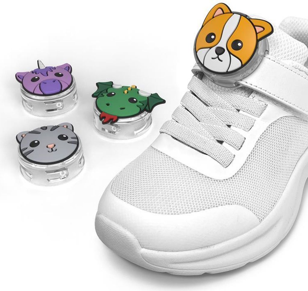 A set of four animal-themed accessories for Apple AirTags, shown next to a white sneaker.