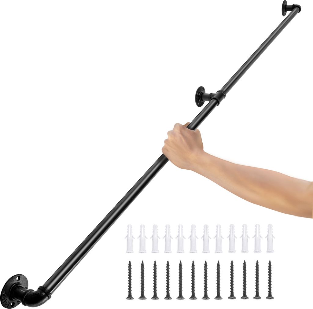 A hand is holding a black metal handrail, which is mounted on a white background. Below the handrail are rows of screws and wall anchors.