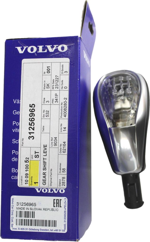 A Volvo gear shift knob and its packaging are displayed on a white background.