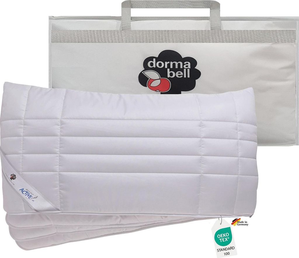 A white pillow is shown in front of a white carrying bag with the Dorma bell logo.