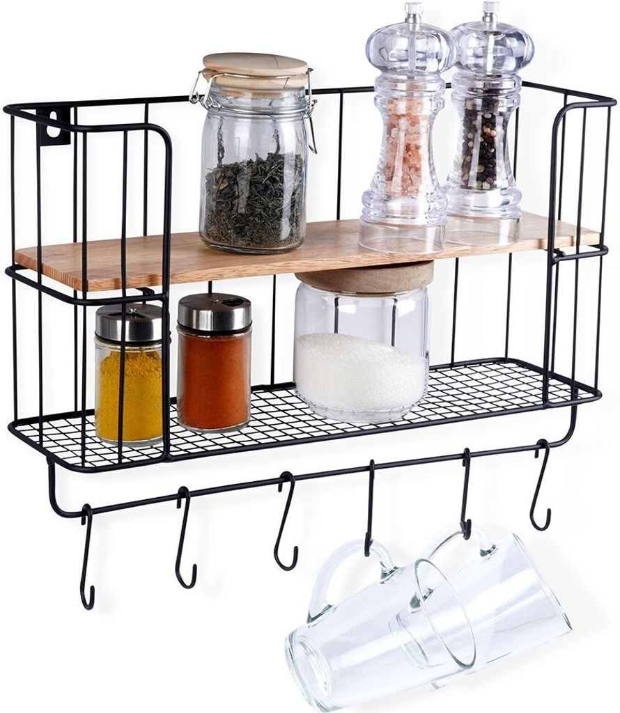 A kitchen shelf with spice jars and grinders.