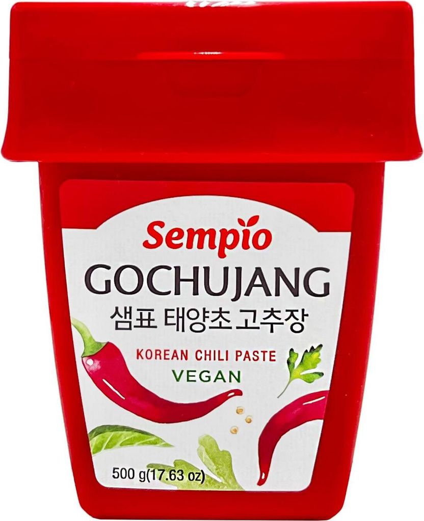 A red container of Sempio Gochujang Korean Chili Paste with illustrations of chili peppers and parsley.