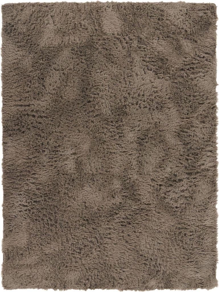 A close-up, top-down view of a fluffy, brown rug.