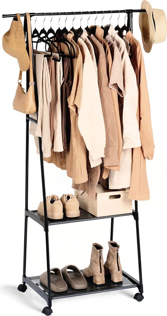 A black metal garment rack with clothing, hats, and shoes on display.