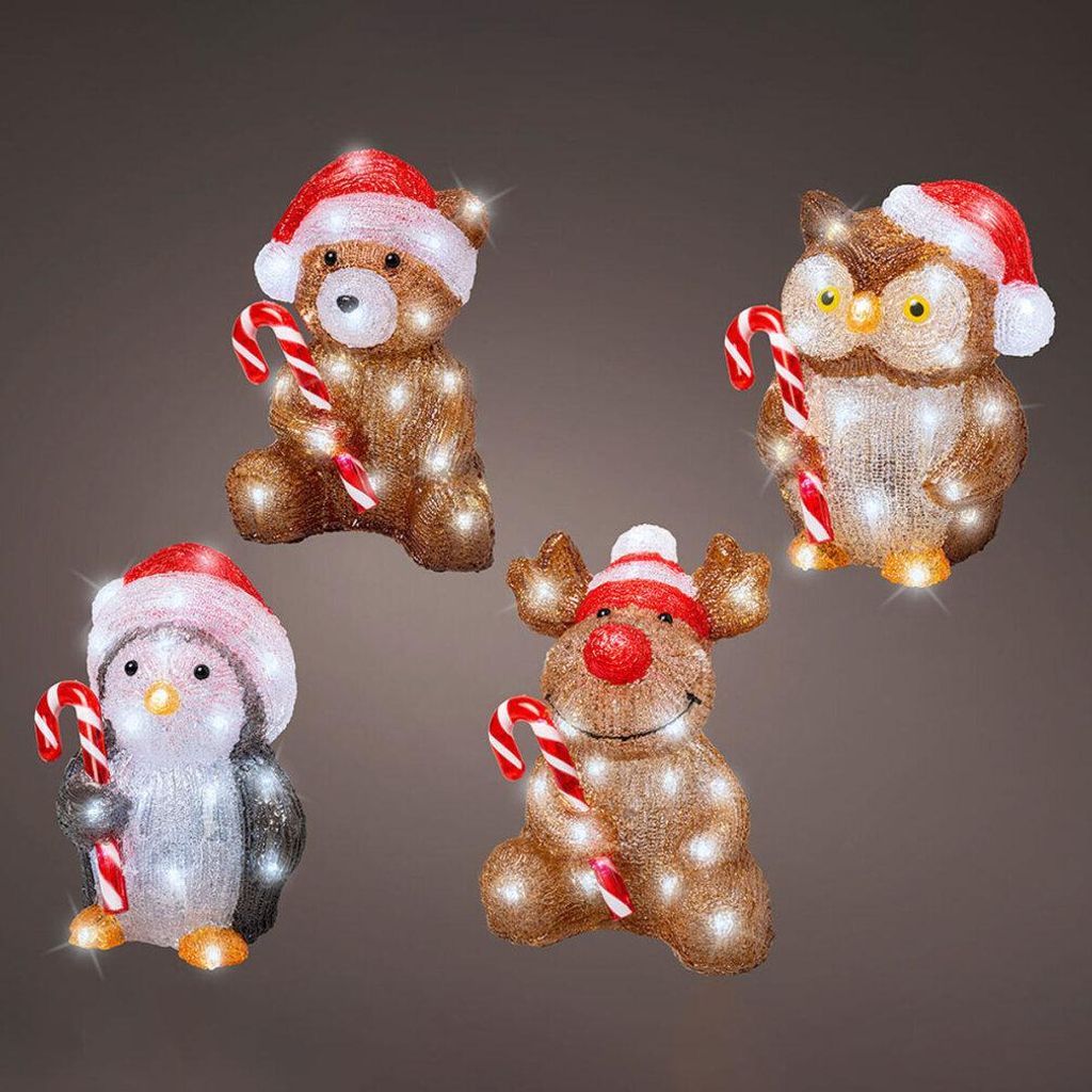 Four illuminated Christmas figures: a bear, an owl, a penguin, and a reindeer, each holding a candy cane and wearing a Santa hat.