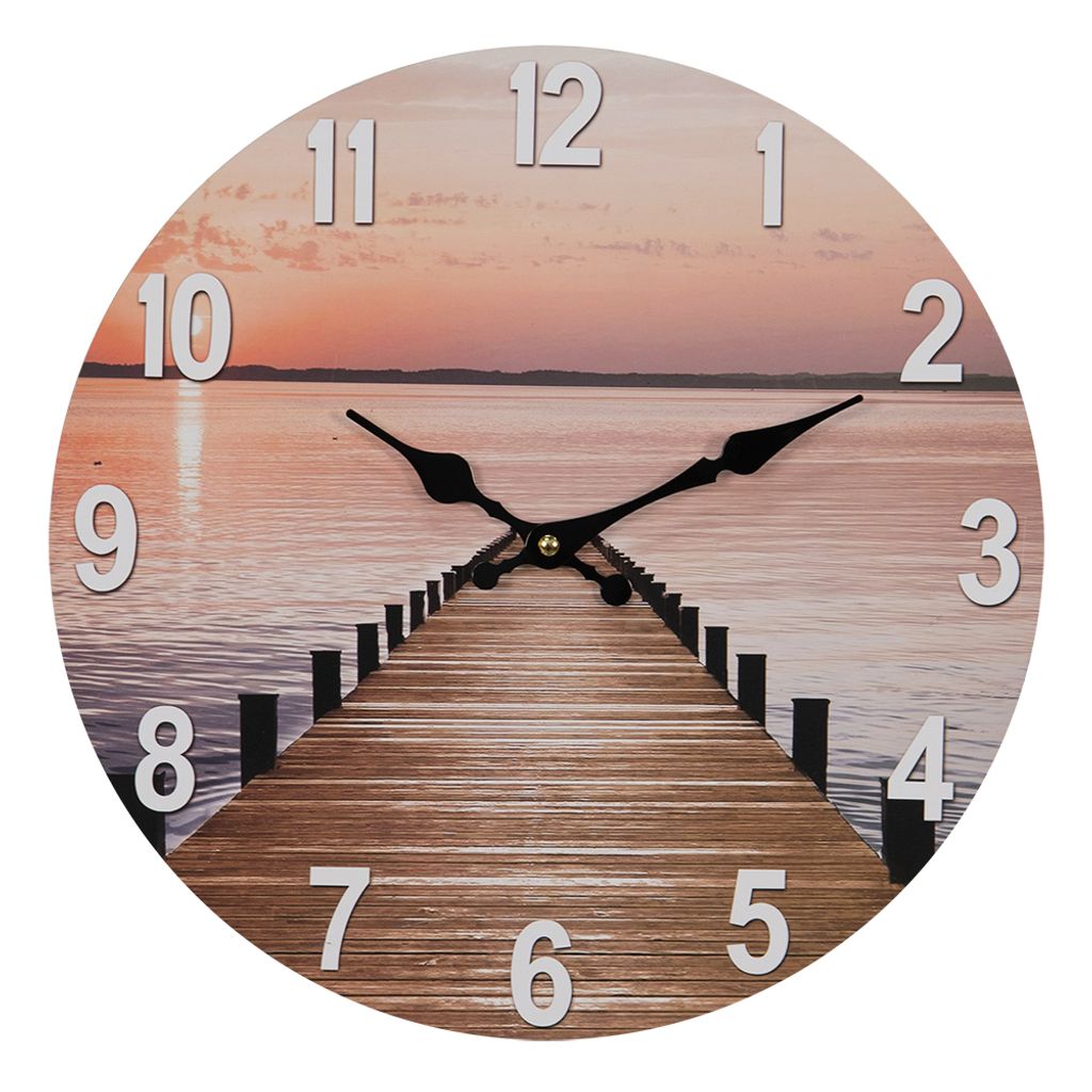 A round wall clock with a sunset and pier image, featuring black clock hands and silver numbers.