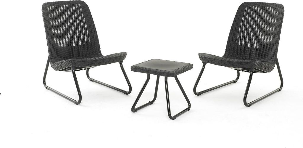 Two chairs and a small table are arranged on a white background.
