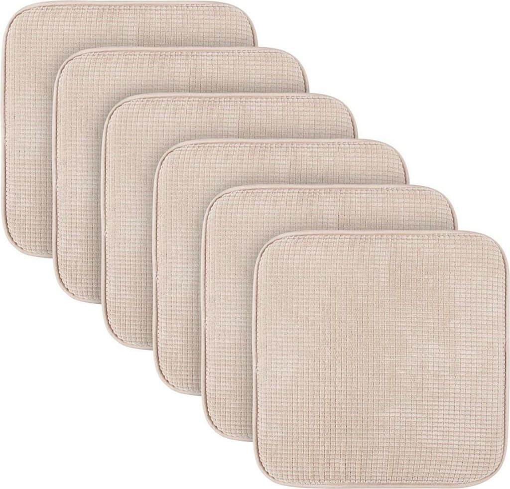 A set of six beige seat cushions arranged in a staggered diagonal pattern against a white background.