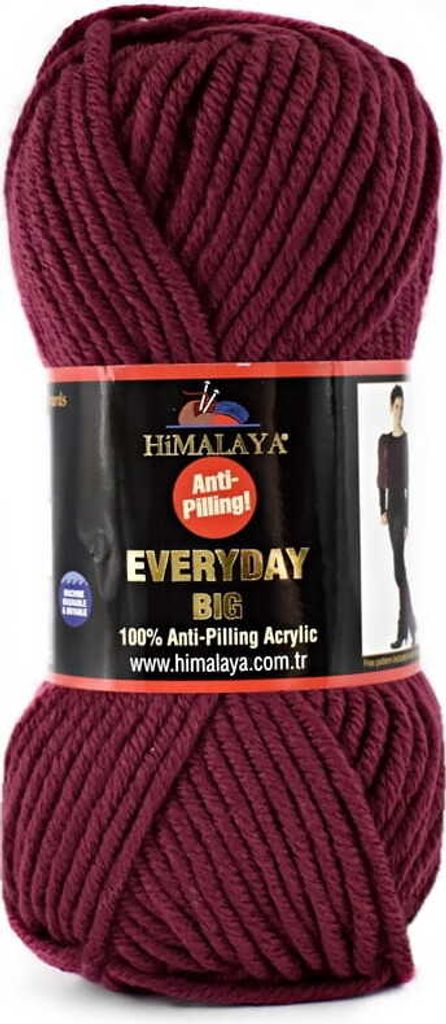 A ball of burgundy yarn with a label wrapped around it.
