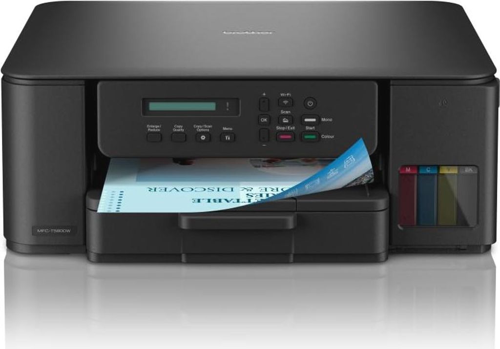 A black Brother printer is shown from the front, with a sheet of paper partially printed and sticking out of the paper tray. The printer has visible ink cartridges on the right side.