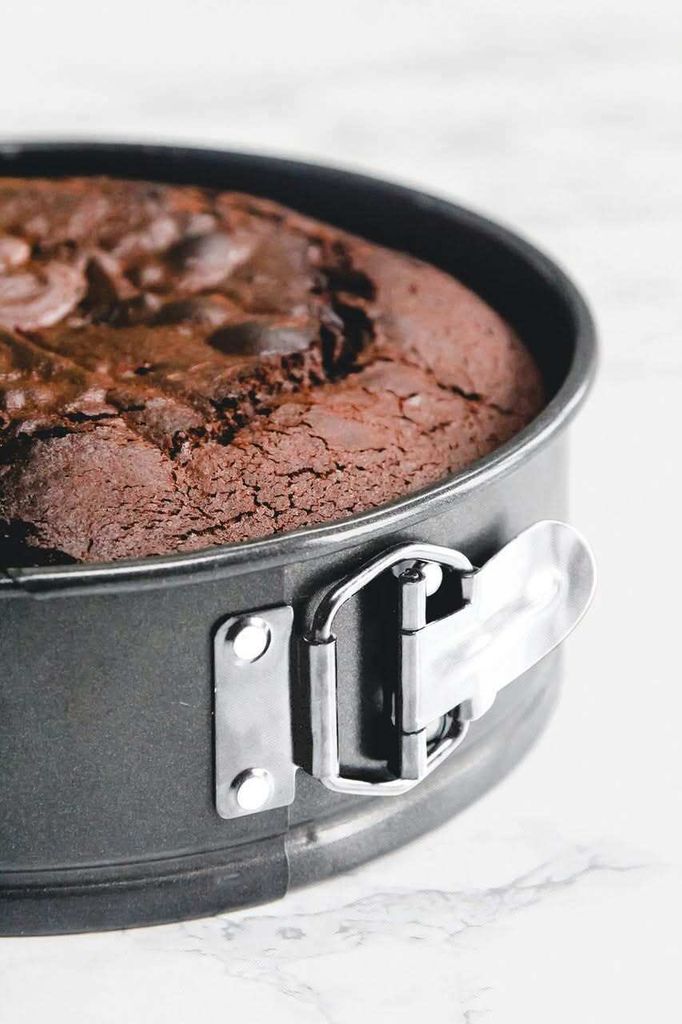 A close-up of a chocolate cake in a springform pan.