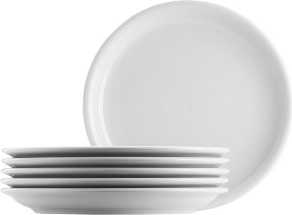 A stack of white plates with one large plate in the background.