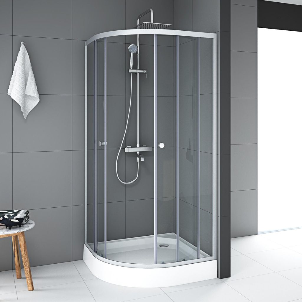 A modern bathroom with a corner shower cabin.