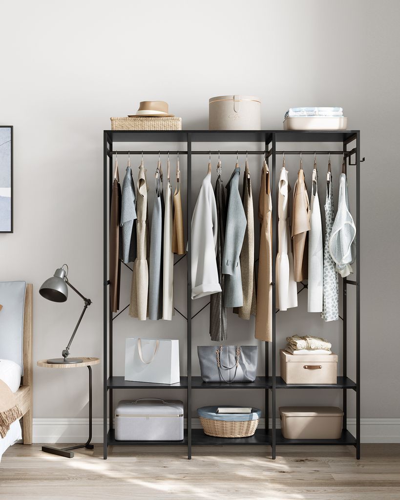 A bedroom scene with a clothing rack.