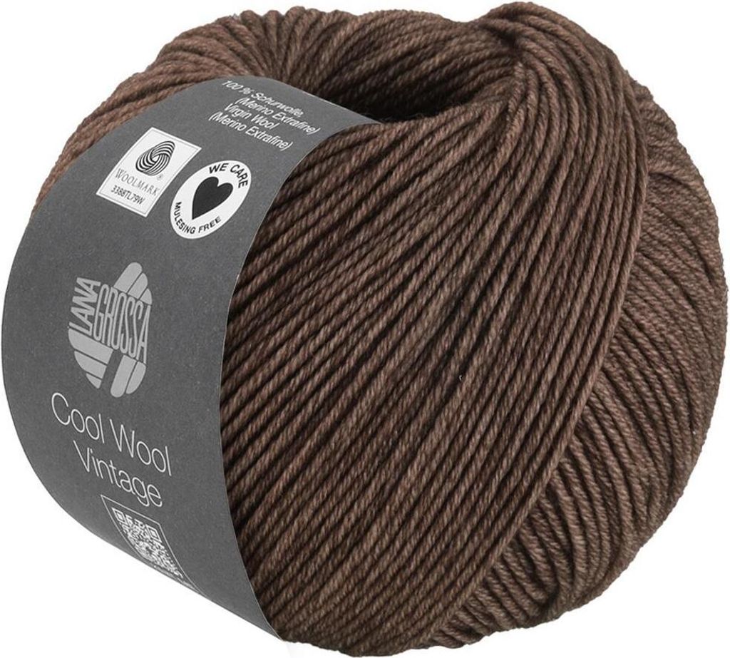 A ball of brown yarn with a label wrapped around it.