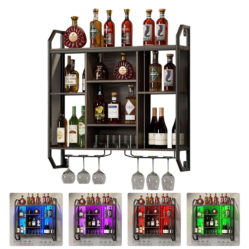 A multi-tiered wine rack filled with various bottles of wine and liquor, with wine glasses hanging from the bottom rack.