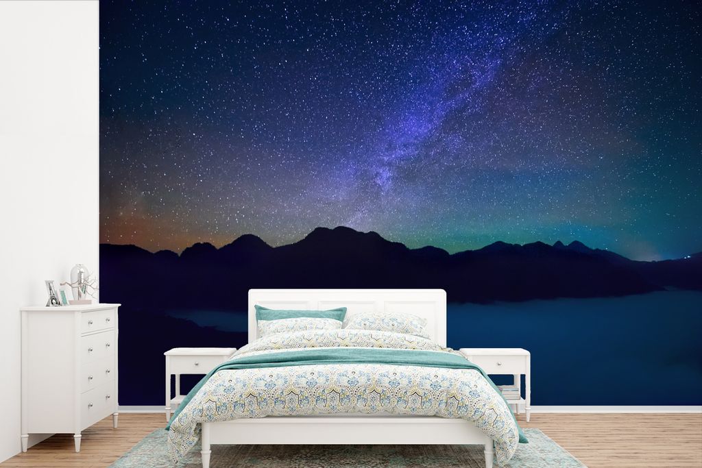 MuchoWow Fototapete für Wohnzimmer oder Schlafzimmer Wandtapete Vinyl Motivtapete Ein schöner Sternenhimmel über der Silhouette eines nächtli...