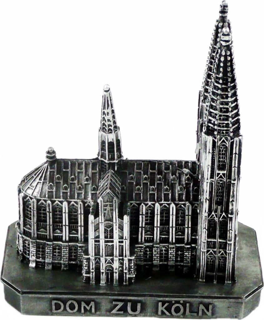 A silver miniature model of a cathedral, likely a souvenir, is displayed against a white background.