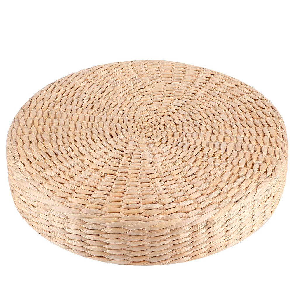A round, thick seat cushion pouf made of woven natural material, presented on a white background.